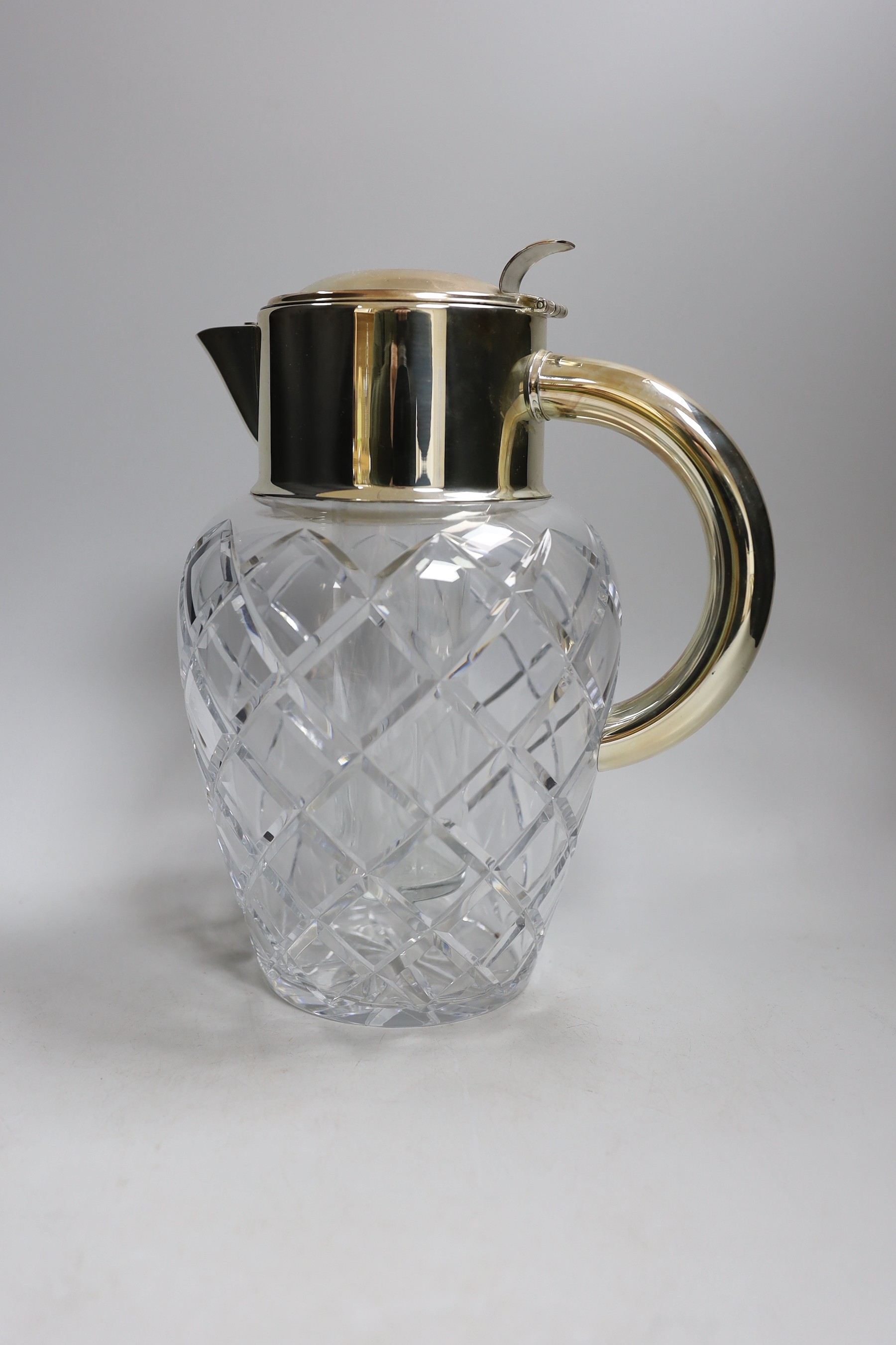 A large cut glass and silver plated jug, possibly for Pimms. 28cm tall